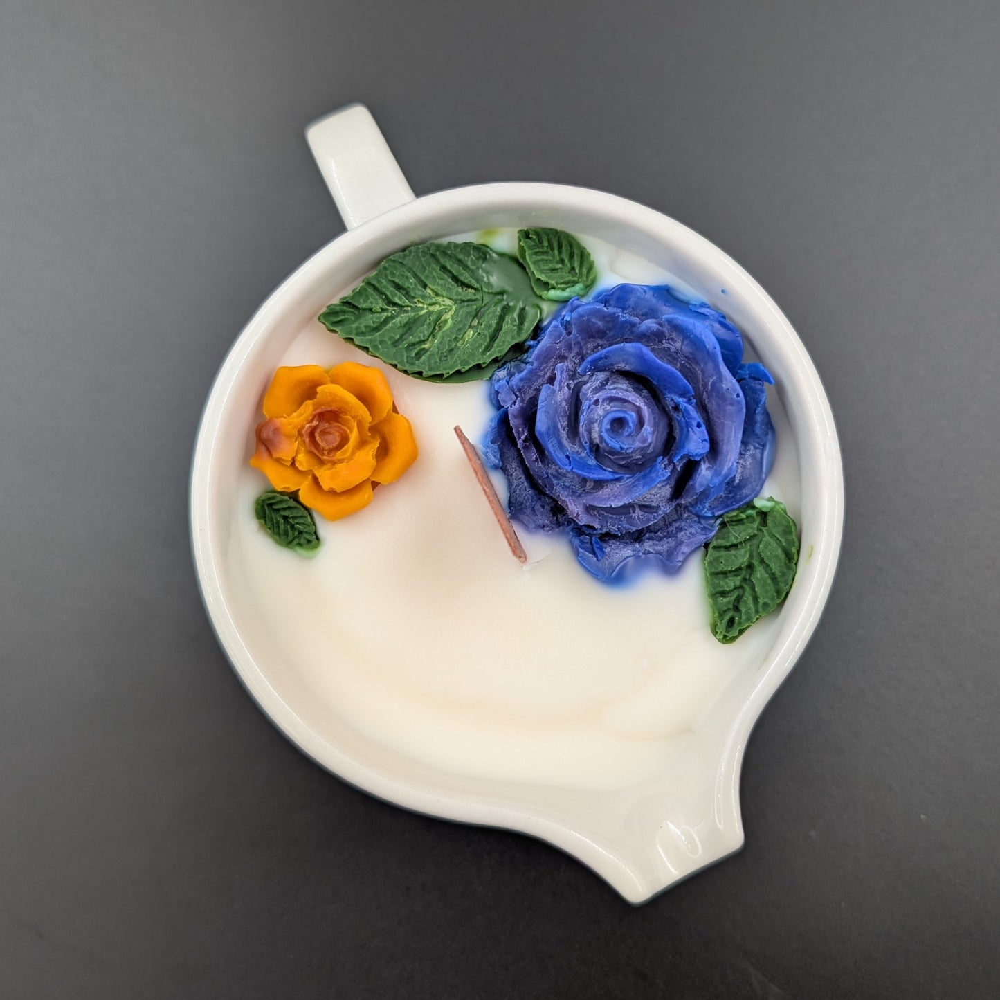 Vintage Villeroy & Boch Acapulco creamer. This scented candle is poured into an authentic Villeroy & Boch Acapulco creamer, marked “Made in Luxembourg” and featuring the iconic blue dove motif. The Acapulco pattern was designed in 1967 by Christine Reuter, inspired by Mexican folk art. Its vibrant birds and flowers are applied to porcelain in the elegant “Milano” shape, created by Ludwig Scherer.