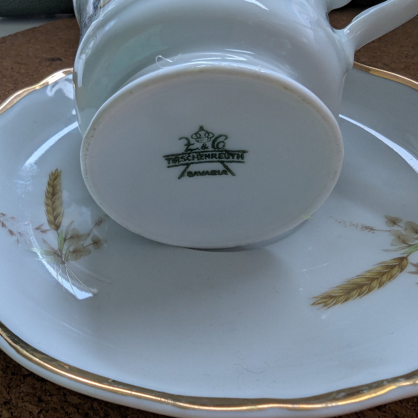scented candle presented in an authentic Bavaria Tirschenreuth cup and saucer, marked with the original backstamp. 
