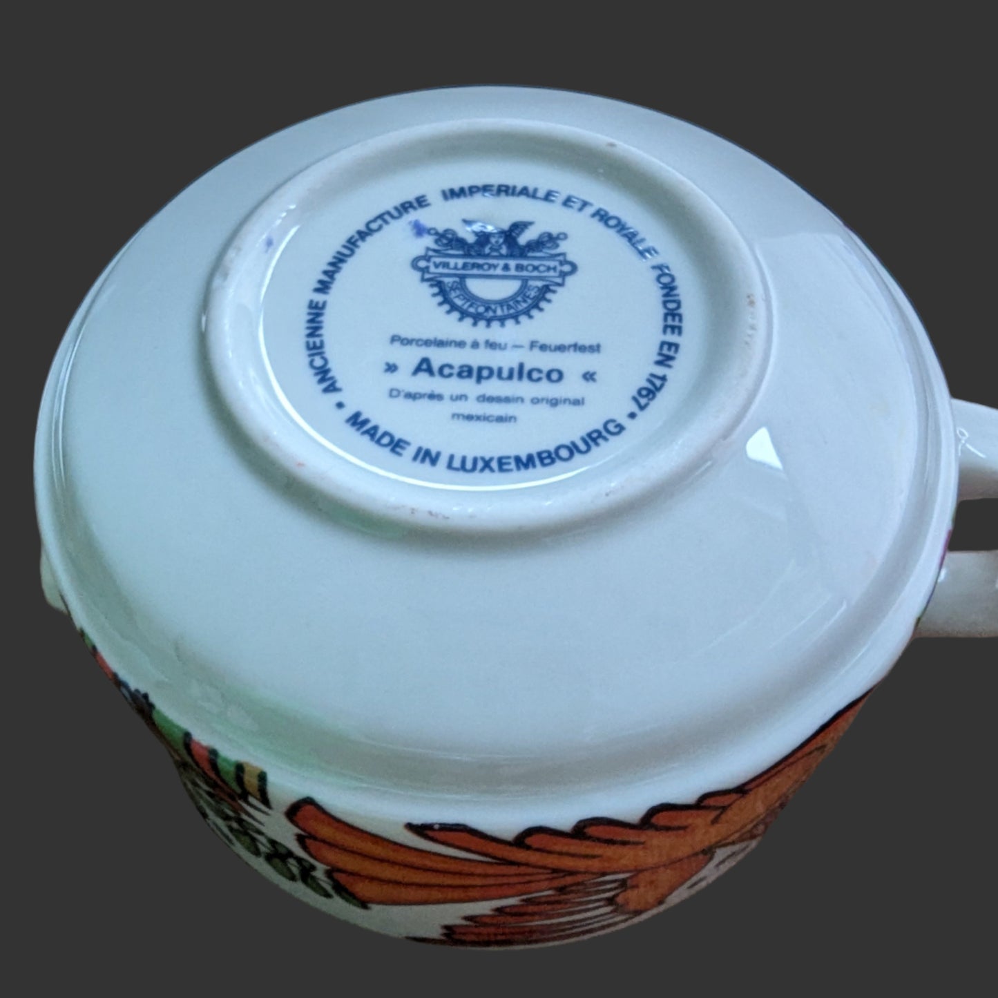 Original Stamp. Vintage Villeroy & Boch Acapulco creamer. This scented candle is poured into an authentic Villeroy & Boch Acapulco creamer, marked “Made in Luxembourg” and featuring the iconic blue dove motif. The Acapulco pattern was designed in 1967 by Christine Reuter, inspired by Mexican folk art. Its vibrant birds and flowers are applied to porcelain in the elegant “Milano” shape, created by Ludwig Scherer. 