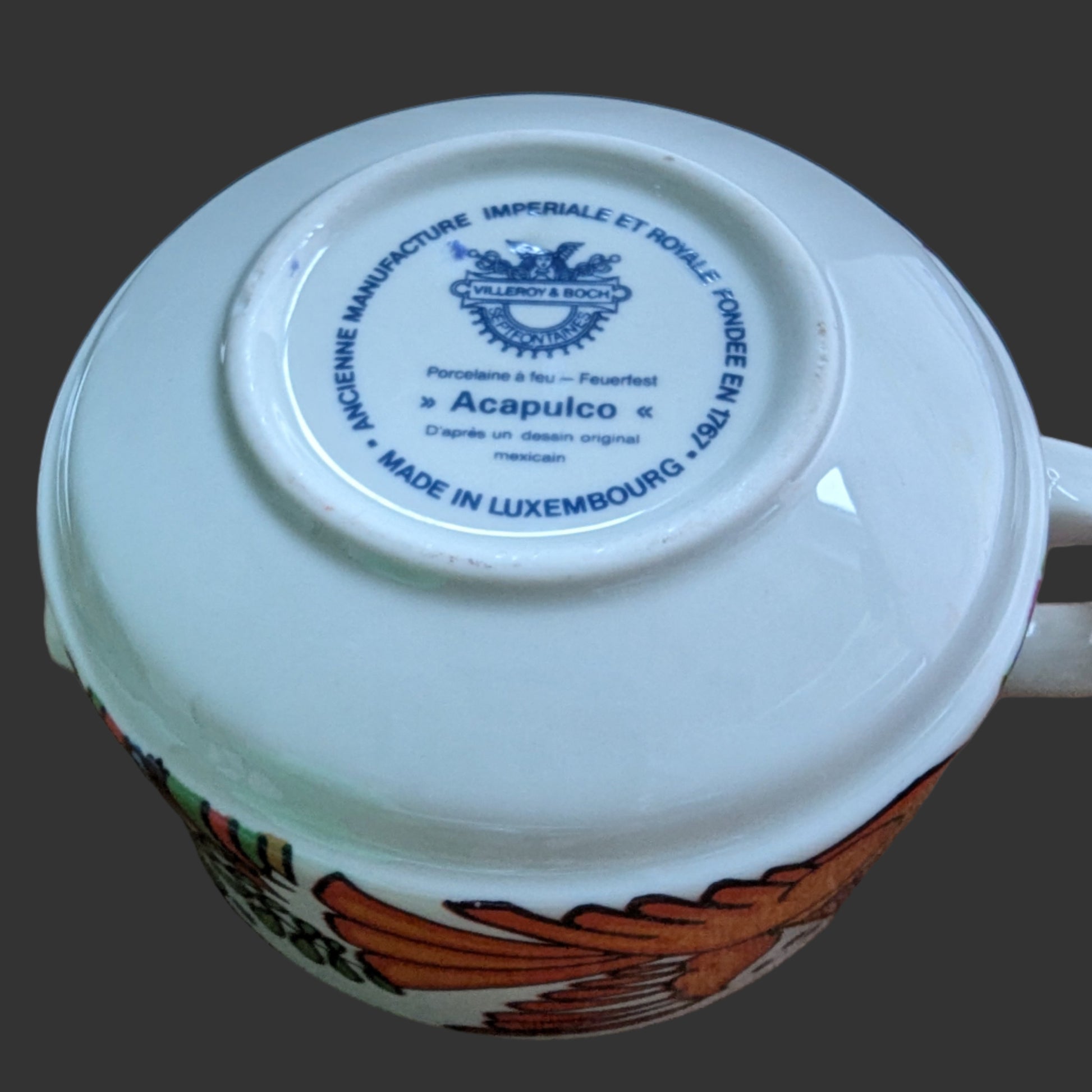 Original Stamp. Vintage Villeroy & Boch Acapulco creamer. This scented candle is poured into an authentic Villeroy & Boch Acapulco creamer, marked “Made in Luxembourg” and featuring the iconic blue dove motif. The Acapulco pattern was designed in 1967 by Christine Reuter, inspired by Mexican folk art. Its vibrant birds and flowers are applied to porcelain in the elegant “Milano” shape, created by Ludwig Scherer. 