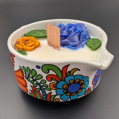 Vintage Villeroy & Boch Acapulco creamer. This scented candle is poured into an authentic Villeroy & Boch Acapulco creamer, marked “Made in Luxembourg” and featuring the iconic blue dove motif. The Acapulco pattern was designed in 1967 by Christine Reuter, inspired by Mexican folk art. Its vibrant birds and flowers are applied to porcelain in the elegant “Milano” shape, created by Ludwig Scherer. 